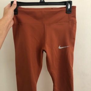 rust orange nike running crop leggings
